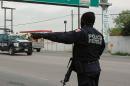 A federal police officer patrols in Tamaulipas on April 26, 2011