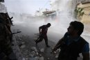 Free Syrian Army fighters run for cover after Syrian forces fired a mortar in the El Amreeyeh neighborhood of Aleppo