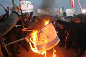 Iranian students set an Israeli flag on fire during …