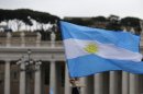 A visitor waves an Argentine flag before the Angelus prayer by Pope Francis in St. Peter's Square at the Vatican, Sunday, March 17, 2013. (AP Photo/Gregorio Borgia)
