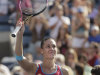 Flavia Pennetta of Italy gestures to the crowd after winning her match against Maria Sharapova of Russia during the U.S. Open tennis tournament in New York, Friday, Sept. 2, 2011. (AP Photo/Charlie Riedel)