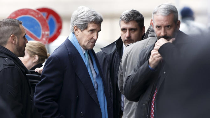 US Secretary of State John Kerry, center, arrives at the hotel  prior to  a bilateral meeting with Iranian Foreign Minister Mohammad Javad Zarif  for a new round of Nuclear Talks, in Geneva, Switzerland, Sunday, Feb.  22, 2015.  (AP Photo/Keystone,Salvatore Di Nolfi)