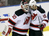 New Jersey Devils goalie Martin Brodeur (30) and Travis Zojac (19) celebrate their 3-2 win over the Florida Panthers in Game 1 of an NHL hockey Stanley Cup first-round playoff series in Sunrise, Fla., Friday, April 13, 2012. (AP Photo/J Pat Carter)