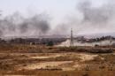 Smoke rises after what Kurdish People's Protection Units (YPG) fighters said was shelling by them on locations controlled by Islamic State fighters in Ghwayran neighborhood in Hasaka city, Syria