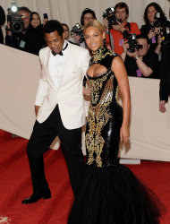FILE - In a May 2, 2011 file photo, Beyonce Knowles and her husband Jay-Z arrive at the Metropolitan Museum of Art Costume Institute gala in New York. Beyonce will battle her husband for video of the year at the BET Awards, and now both performers are confirmed to attend, The Associated Press reports Friday, June 29, 2012. Beyonce is the second most nominated act. She's up for six awards. Jay-Z is nominated for five. (AP Photo/Evan Agostini, File)