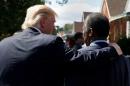 After hesitation, Carson accepts Trump's offer to head U.S. housing department