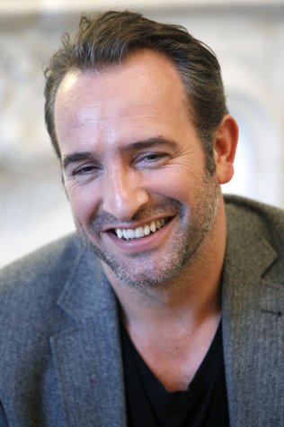 French actor Jean Dujardin addresses reporters during an interview with the Associated Press in Paris, Tuesday, Jan. 24, 2012. The movie, 'The Artist', in which Jean Dujardin plays main role, is nominated 10 times for the Oscar, amongst them writing and directing nominations for French filmmaker Michel Hazanavicius, a best-actor honor for Jean Dujardin and a supporting-actress nod for Berenice Bejo. (AP Photo/Remy de la Mauviniere)