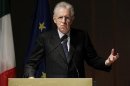 Italian PM Monti gestures as he speaks during the opening ceremony of the academic year at the Bocconi University in Milan