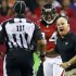 Atlanta Falcons head coach Mike Smith, right, argues for a pass interference call on a play involving wide receiver Roddy White, center, with an official during the second half of their NFL football game against the Denver Broncos, Monday, Sept. 17, 2012, in Atlanta. The Falcons won 27-21. (AP Photo/Atlanta Journal-Constitution, Curtis Compton)  MARIETTA DAILY OUT; GWINNETT DAILY POST OUT; LOCAL TV OUT; WXIA-TV OUT; WGCL-TV OUT