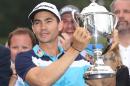Camilo Villegas of Colombia poses with the Sam Snead Cup after winning the Wyndham Championship at Sedgefield Country Club on August 17, 2014 in Greensboro, North Carolina