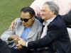Muhammad Ali, left, rides onto the field with Miami Marlins owner Jeffrey Loria during Opening Day events before a baseball game between the Miami Marlins and the St. Louis Cardinals, Wednesday, April 4, 2012, in Miami. (AP Photo/Wilfredo Lee)