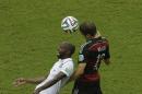 United States' DaMarcus Beasley, left, and Germany's Thomas Mueller battle for control of the ball during the group G World Cup soccer match between the USA and Germany at the Arena Pernambuco in Recife, Brazil, Thursday, June 26, 2014. (AP Photo/Hassan Ammar)