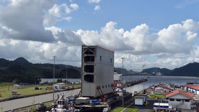 The last gate to be used on a new set of locks on the Panama Canal arrives in Panama City on December 10, 2014