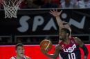 United States's Kyrie Irving, right, goes for the basket in front Turkey's Baris Hersek, left, during the Group C Basketball World Cup match, in Bilbao northern Spain, Sunday, Aug. 31, 2014. The 2014 Basketball World Cup competition take place in various cities in Spain from last Aug. 30 through to Sept. 14. (AP Photo/Alvaro Barrientos)