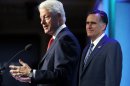 Republican presidential candidate and former Massachusetts Governor Mitt Romney listens as former U.S. President Bill Clinton (L) introduces him at the Clinton Global Initiative in New York
