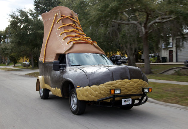 In this Jan. 13, 2012 photo provided by L.L. Bean, the so-called Bootmobile is driven down a street in Kissimmee, Florida. In 1912 L.L. Bean sold his first pair of boots. The privately held company ex