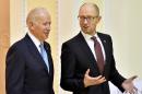 US Vice President Joe Biden (L) talks with Ukrainian Prime Minister Arseniy Yatsenyuk on December 7, 2015, during a three-day working visit intended to signal support for Kiev amid its ongoing clash with Moscow
