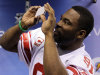 New York Giants defensive end Justin Tuck takes a picture during Media Day for NFL football's Super Bowl XLVI Tuesday, Jan. 31, 2012, in Indianapolis. (AP Photo/Mark Humphrey)