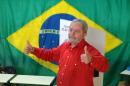 Brazilian former president Luiz Inacio Lula da Silva votes during the presidential run-off in election in Sao Bernardo do Campo on October 26, 2014