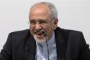 Iranian FM Zarif smiles as he speaks to the media at the International Conference Centre of Geneva in Geneva