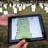 Army Spc. Matthew Caruso, 24, of Poughkeepsie, N.Y., shows the Apple iPad and spreadsheet which is used to keep track of which headstones the Army Old Guard has photographed at Arlington National Cemetery as part of Task Force Christman to photograph and catalog more than 219,00 grave markers and the front of more than 43,000 sets of cremated remains at Arlington National Cemetery in Arlington, Va., Wednesday, Aug. 24, 2011. Night after night this summer, troops have left their immaculately pressed dress blues, white gloves and shiny black boots, photographing each and every grave with an iPhone. (AP Photo/Cliff Owen)