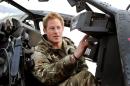 FILE - In this Dec. 12, 2012, file photo Britain's Prince Harry makes his early morning pre-flight checks on the flight-line, from Camp Bastion southern Afghanistan. Palace officials say that Prince Harry is ending his role as a helicopter pilot and taking up a new job with the army in London. Kensington Palace said Harry — known in the army as Capt. Wales — will now be organizing "major commemorative events" involving the army. (AP Photo/ John Stillwell, Pool)