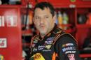 File photo of NASCAR Sprint Cup Series driver Tony Stewart speaking with crew members during practice for the Daytona 500 qualifying at Daytona International Speedway