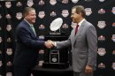 Alabama head coach Nick Saban and Notre Dame head coach Brian Kelly pose with The Coaches' Trophy during a news conference for the BCS National Championship college football game Sunday, Jan. 6, 2013, in Miami. (AP Photo/John Bazemore)
