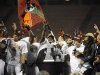 Virginia Tech players take the stage with their trophy after defeating  Rutgers 13-10 in overtime of an NCAA college football Russell Athletic Bowl game on Friday, Dec. 28, 2012, in Orlando, Fla. (AP Photo/Brian Blanco)