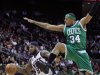 Boston Celtics' Paul Pierce (34) defends New Jersey Nets' DeShawn Stevenson (92) during the first quarter of an NBA basketball game in Newark, N.J., Saturday, April 14, 2012. (AP Photo/Mel Evans)