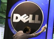 A man wipes the logo of the Dell IT firm at the CeBIT exhibition centre in Hannover February 28, 2010. REUTERS/Thomas Peter