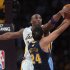 Kobe Bryant of the Los Angeles Lakers blocks a shot by Andre Miller of the Denver Nuggets
