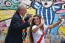 Presidential candidate Pedro Pablo Kuczynski of the "Peruanos por el Kambio" political party dances with a supporter during a breakfast before casting his ballot in Lima, Peru, Sunday, June 5, 2016. Peru is holding a runoff presidential election between Kuczynski and Keiko Fujimori, the daughter of Peru's former strongman. (AP Photo/Martin Mejia)