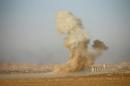 Smoke rises from clashes during a battle with Islamic State militants at the airport of Tal Afar west of Mosul