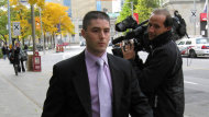 Toronto police Const. David Cavanagh, centre, is charged with second-degree murder.