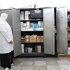 A nurse looks at a cupboard of supplies at the Al-Jalaa hospital in Benghazi