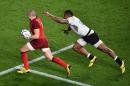 England's fullback Mike Brown (L) runs to score a try during a Pool A match of the 2015 Rugby World Cup between England and Fiji at Twickenham stadium in south west London on September 18, 2015