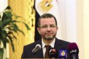 Egypt's PM Kandil speaks during a news conference in Doha
