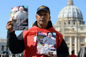 A street vendor holds the new Italian magazine Il Mio …