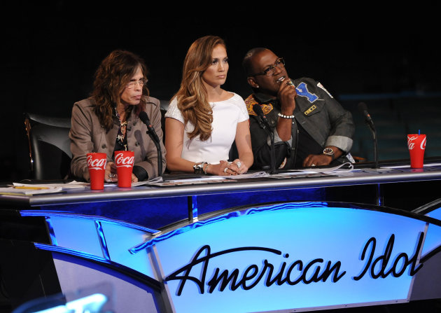 FILE - In this file image released by Fox, judges from left, Steven Tyler, Jennifer Lopez and Randy Jackson listen to contestants on the singing competition series "American Idol." (AP Photo/Fox, Michael Becker, File)