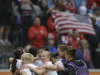 US players celebrate winning 3-1 the semifinal match between France and the United States at the Women’s Soccer World Cup in Moenchengladbach, Germany, Wednesday, July 13, 2011. (AP Photo/Marcio Jose Sanchez)