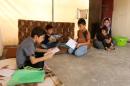 Displaced Yazidi children study English after an English course in Dohuk
