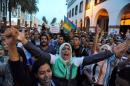 Protests take part in a rally called by the February 20 Movement in Rabat after a fishmonger in the northern town of Al Hoceima was crushed to death inside a rubbish truck as he tried to retrieve fish confiscated by police