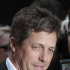 FILE - In this Monday, May 9, 2011 file photo of  British actor Hugh Grant, as he poses with fans as he arrives for the European premiere of the 'Fire in Babylon' film at a cinema in London. Film star Hugh Grant, "Harry Potter" author J.K. Rowling, and the father of missing girl Madeleine McCann are among those due to testify starting Monday Nov. 21, 2011 and over the next week at the U.K. inquiry into media ethics _ a judicial body that could recommend sweeping changes to the way Britons get their news.  (AP Photo/Lefteris Pitarakis, File)