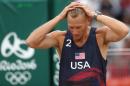 United States' Casey Patterson reacts after loosing a point during a men's beach volleyball match against Spain at the 2016 Summer Olympics in Rio de Janeiro, Brazil, Wednesday, Aug. 10, 2016. (AP Photo/Petr David Josek)