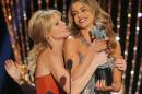 Julie Bowen and Sofia Vergara fight over the award for Outstanding Performance by an Ensemble in a Comedy Series for "Modern Family" as they joke around at the Screen Actors Guild Awards in Los Angeles