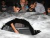 Palestinians inspect the wreckage of a car after it was hit by an Israeli missile strike in Beit Lahia, northern Gaza Strip,  Sunday, Aug. 21, 2011. (AP Photo/Hatem Moussa)