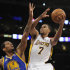 Los Angeles Lakers point guard Ramon Sessions (7) goes up for a basket over Golden State Warriors forward Jeremy Tyler (3) during the first half of an NBA basketball game in Los Angeles , Sunday, April 1, 2012. (AP Photo/Lori Shepler)