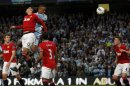 Manchester City's Vincent Kompany heads and scores during their Premier League match against Manchester United at the Etihad stadium in Manchester