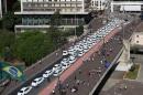 Taxis are seen parked on the street during a protest against online car-sharing service Uber, in front of the city hall of Sao Paulo, Brazil